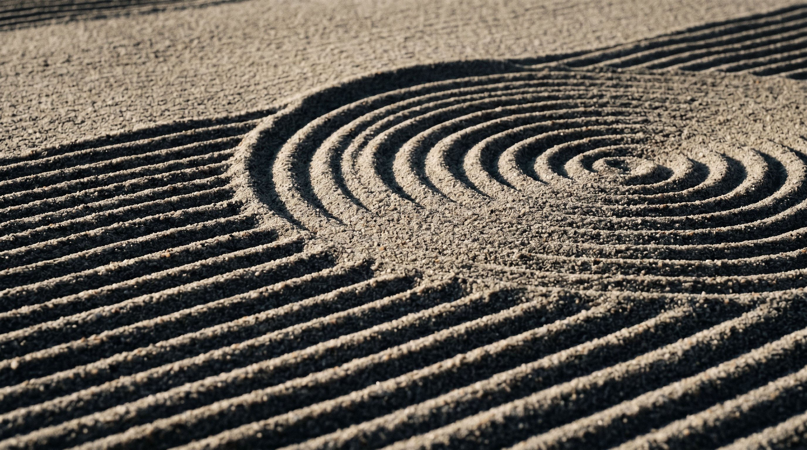 Raked sand patterns in a Japanese Zen garden